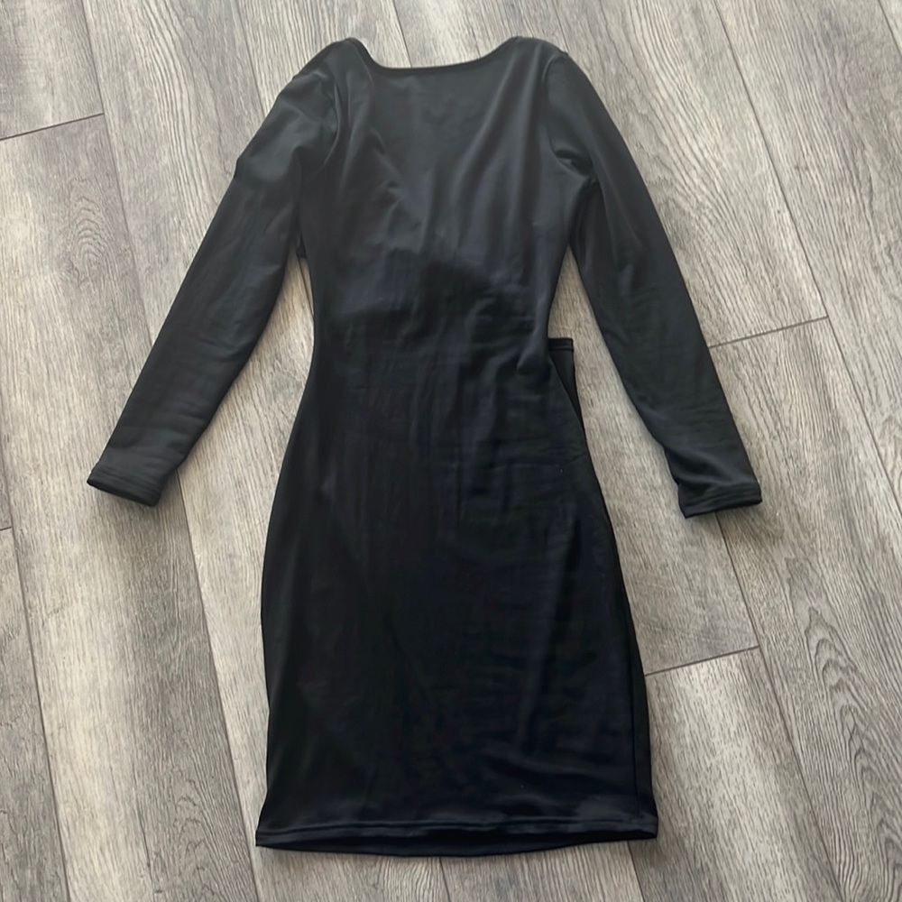 Adorable long sleeve little black dress with open criss cross back